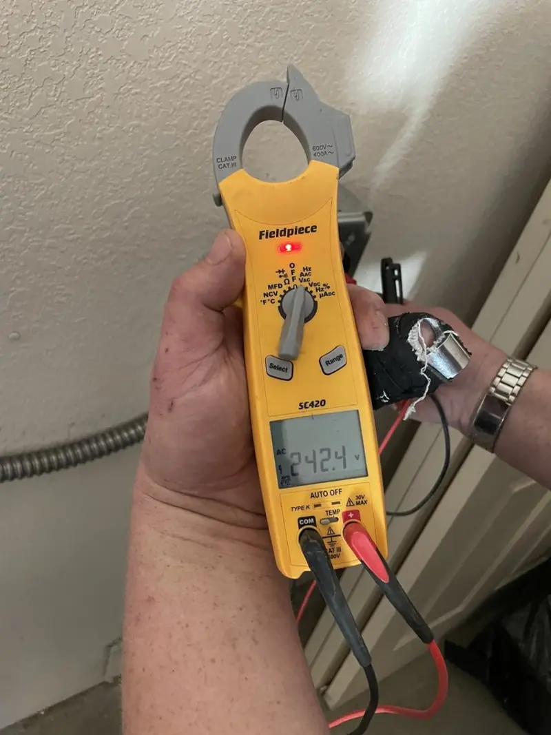 Voltage testing with clamp meter during Aluminum Wiring Replacement in Peters